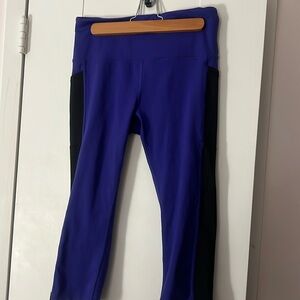 Purple with black stripe on side active capris by Xersion (JCPenney) size medium